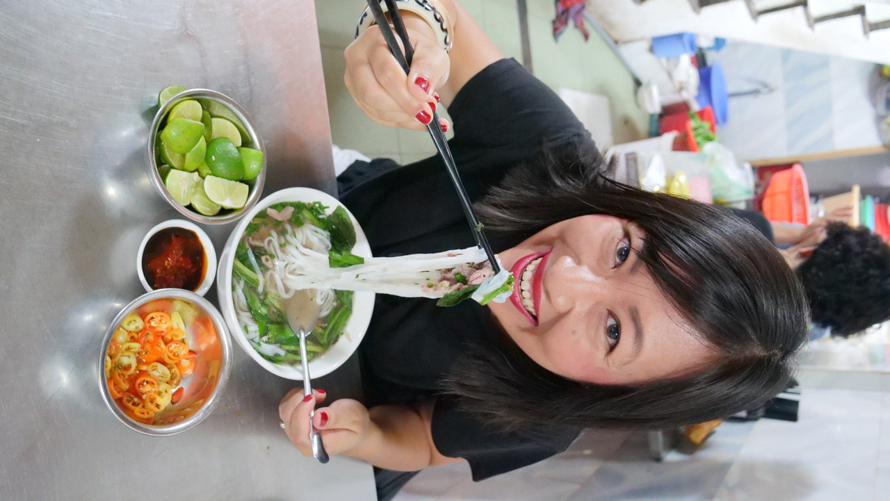 In this photo provided to Tuoi Tre News, Sheena Southam is having a bowl of 'pho bo' (beef noodle soup) at a stall in Ho Chi Minh City.