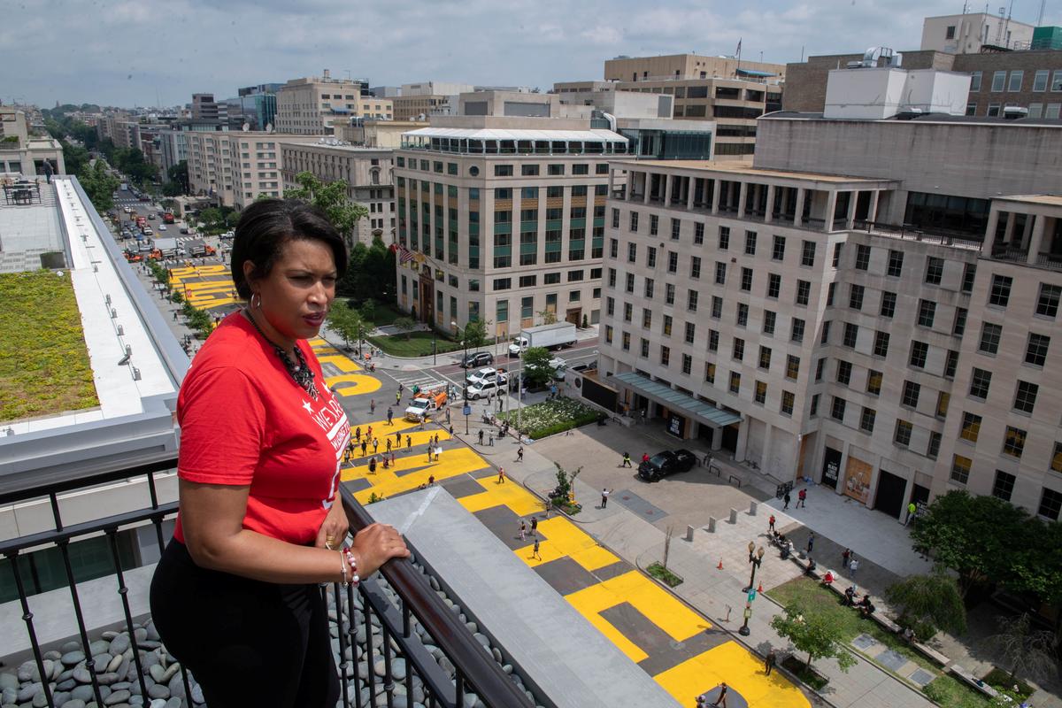 Mayor Muriel Bowser looks out over a Black Lives Matter sign that was painted on a street, during nationwide protests against the death in Minneapolis police custody of George Floyd, in Washington, D.C., June 5, 2020. Photo: Reuters