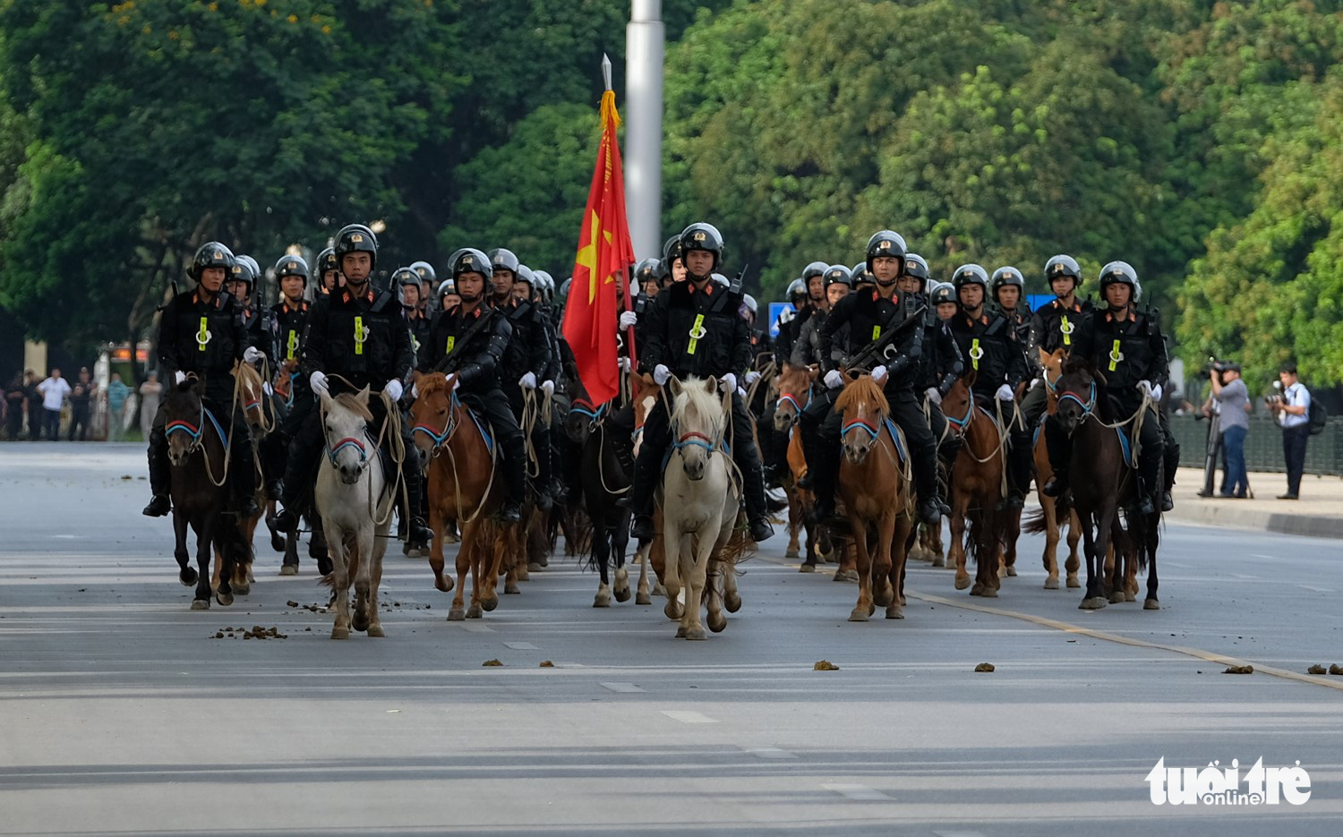 Officers from the Mounted Mobile Police Corps march during a ceremony at Ba Dinh Square in Hanoi, Vietnam, June 8, 2020. Photo: Tien Long / Tuoi Tre