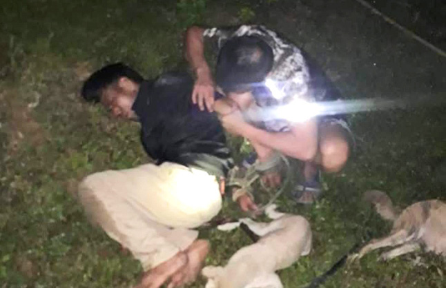 One of the suspects is captured for poisoning and stealing dogs and cats in Thanh Hoa Province, Vietnam, June 14, 2020 in this supplied photo.