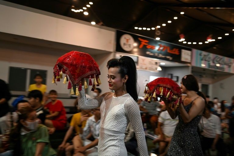 A traditional Vietnamese ao dai dress worn by a member of the Sai Gon Tan Thoi LGBT lotto troupe. Photo: AFP