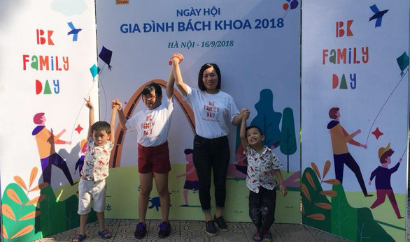 Hoang Thi Kim Dung and her three children are seen at an event held at Hanoi University of Science and Technology, Vietnam in this supplied photo