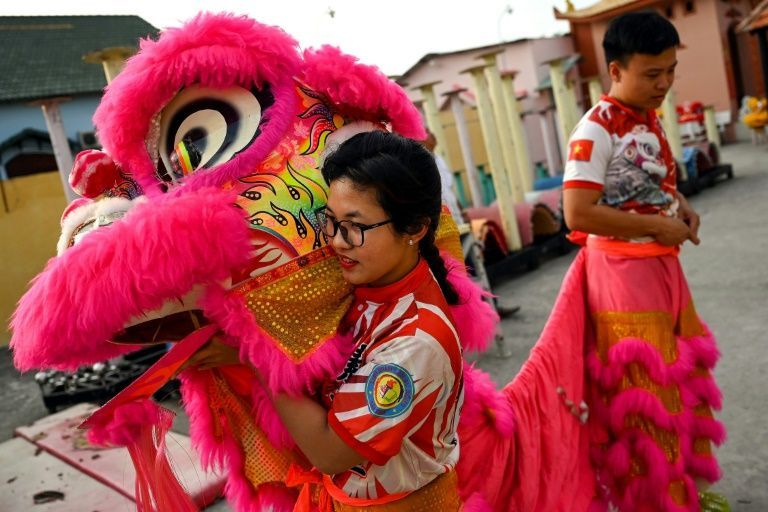 Lion dances are physically demanding, requiring agility and power to excel at the traditional sport. Photo: AFP