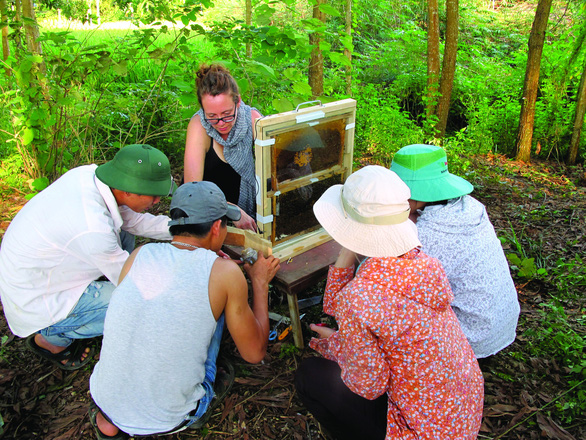 Canadian professor Gard Otis (right, seated) and his associates are pictured during a field trip to Ba Vi District in suburban Hanoi, Vietnam in 2013 in this supplied photo