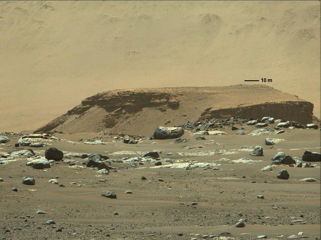 A tall outcropping of rock, with layered deposits of sediments in the distance, marking a remnant of an ancient, long-vanished river delta in Jezero Crater, are pictured in this undated image taken by NASA's Mars rover Perseverance from its landing site, and supplied to Reuters on March 5, 2021. Photo: Reuters