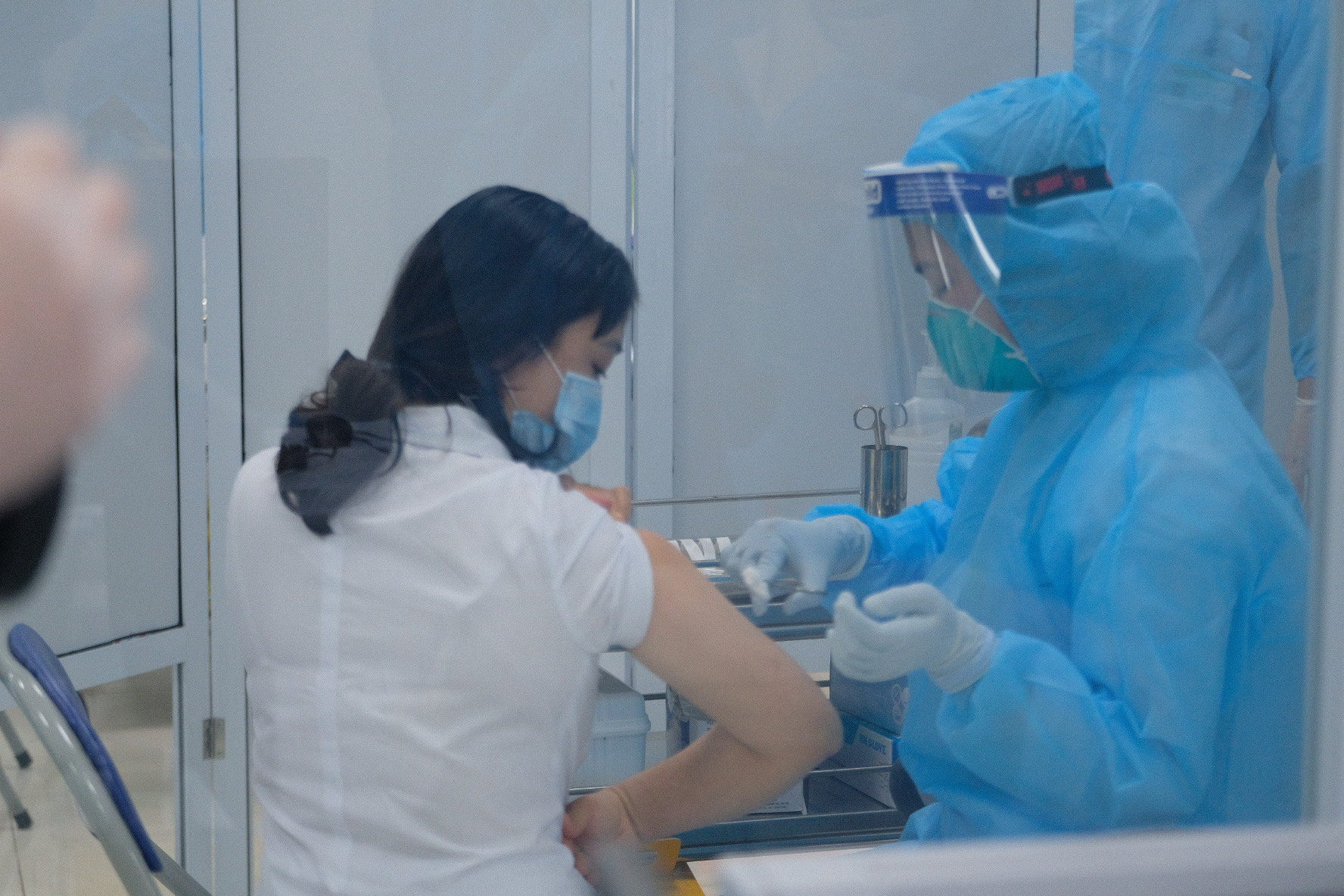 A health worker gets vaccinated at the National Hospital for Tropical Diseases in Hanoi, March 8, 2021. Photo: Nam Tran / Tuoi Tre
