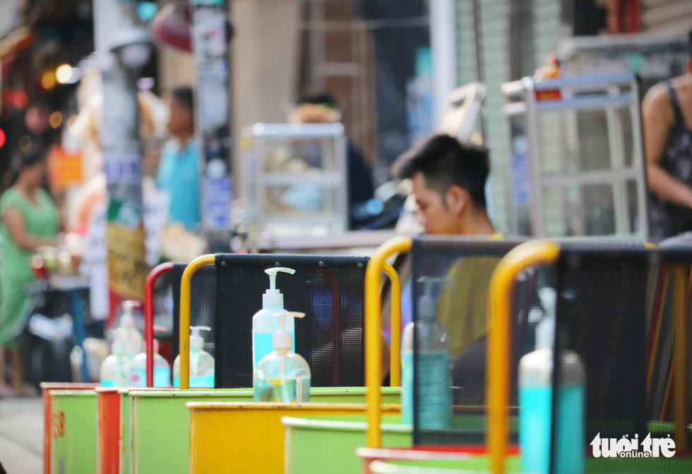 Bottles of hand sanitizer are placed on a table for customers’ use at a drinking establishment on Bui Vien Street in District 1, Ho Chi Minh City, March 9, 2021. Photo: Nhat Thinh / Tuoi Tre