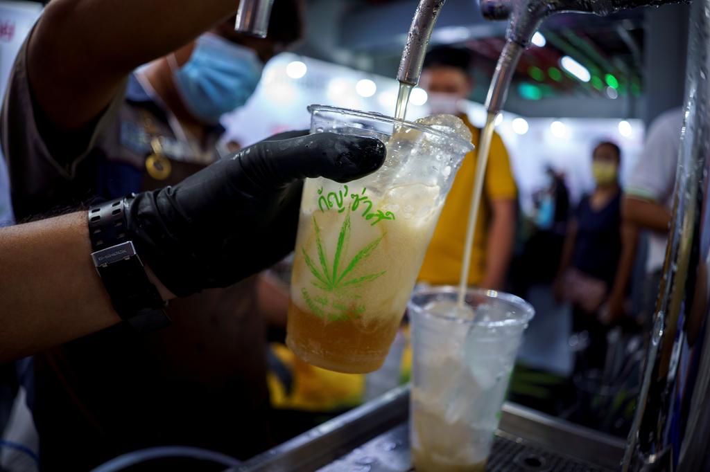 Bartenders serve cannabis-mixed sparkling craft soda during the '360 Cannabis & Hemp for the People' expo in Buriram province, Thailand, March 5, 2021. Photo: Reuters