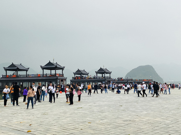 Visitors crowd a wharf at Tam Chuc Pagoda Complex, the country's largest Buddhism compound, on March 14, 2021 in this supplied photo.